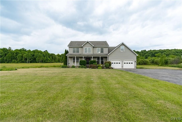 33039 County Route 22, Antwerp, NY 13691 - colonial-style house featuring driveway, a front lawn, covered porch, and a forest view