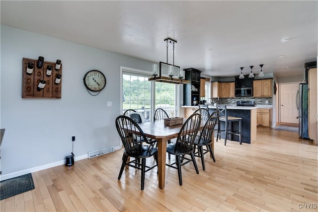 33039 County Route 22, Antwerp, NY 13691 - dining room featuring light wood-style floors and baseboards