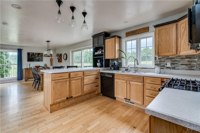 33039 County Route 22, Antwerp, NY 13691 - kitchen featuring dishwasher, a peninsula, light countertops, tasteful backsplash, and recessed lighting