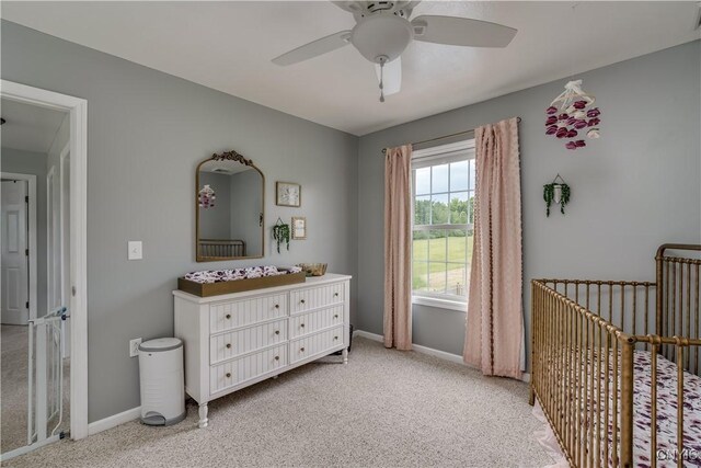 33039 County Route 22, Antwerp, NY 13691 - bedroom with a crib, light carpet, and ceiling fan