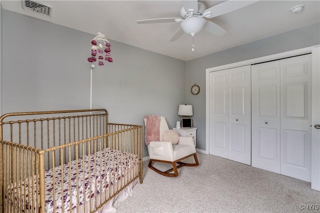 33039 County Route 22, Antwerp, NY 13691 - carpeted bedroom featuring a crib, a closet, and a ceiling fan