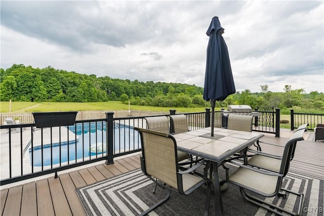 33039 County Route 22, Antwerp, NY 13691 - wooden terrace with outdoor dining space, grilling area, and a forest view
