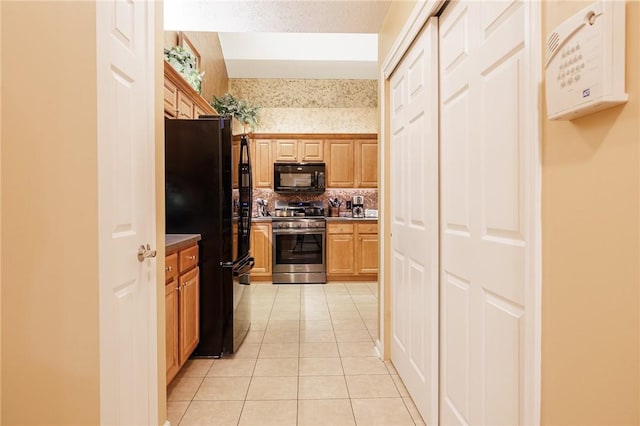 148 Maryview Dr Unit 148, Webster, NY 14580 - kitchen featuring black appliances, light tile patterned floors, and decorative backsplash