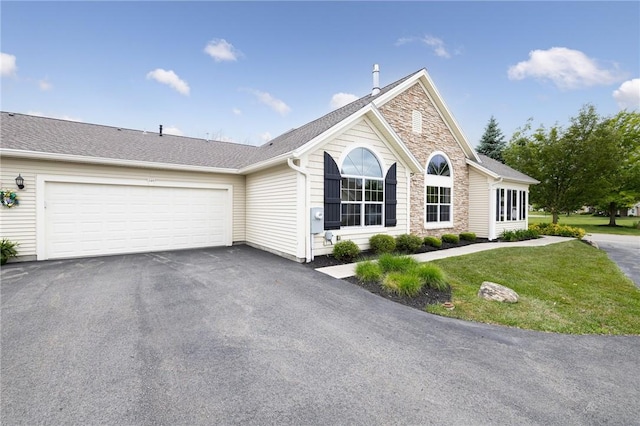 148 Maryview Dr Unit 148, Webster, NY 14580 - ranch-style house featuring stone siding, asphalt driveway, a garage, and a front yard