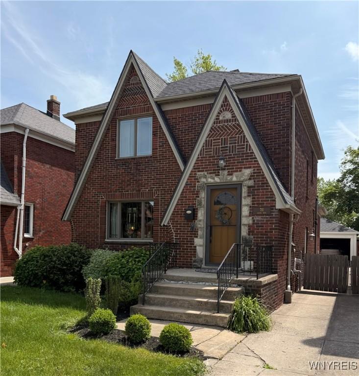 711 Colvin Blvd, Tonawanda-Town, NY 14217 - tudor house featuring brick siding
