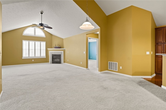 189 Maryview Dr, Penfield, NY 14580 - unfurnished living room with ceiling fan, lofted ceiling, carpet flooring, and a tile fireplace