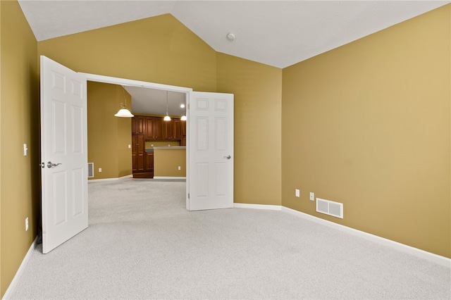 189 Maryview Dr, Penfield, NY 14580 - empty room featuring light carpet and vaulted ceiling