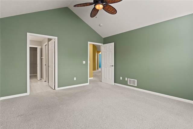 189 Maryview Dr, Penfield, NY 14580 - unfurnished bedroom featuring a spacious closet, light carpet, high vaulted ceiling, a closet, and a ceiling fan