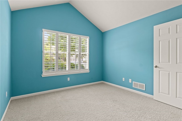 189 Maryview Dr, Penfield, NY 14580 - carpeted empty room with vaulted ceiling and baseboards