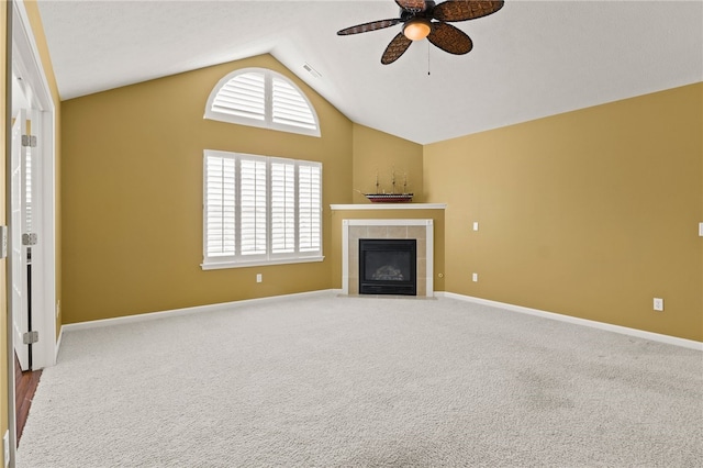 189 Maryview Dr, Penfield, NY 14580 - unfurnished living room featuring ceiling fan, a tiled fireplace, carpet flooring, and high vaulted ceiling