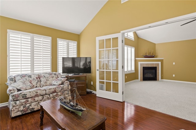 189 Maryview Dr, Penfield, NY 14580 - living area featuring wood finished floors, a fireplace, and high vaulted ceiling