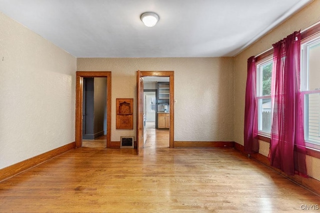 218-20 Avery Ave, Syracuse, NY 13204 - spare room with light wood-style flooring and baseboards