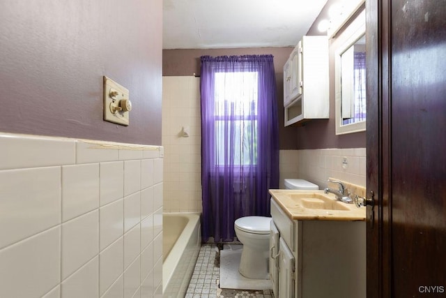 218-20 Avery Ave, Syracuse, NY 13204 - full bath with tile walls, vanity, a wainscoted wall, and tile patterned floors