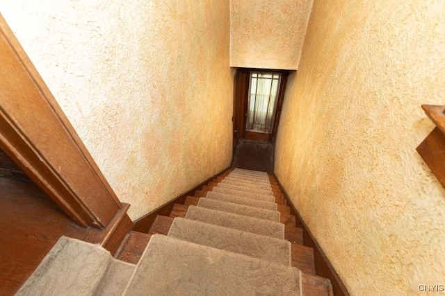 218-20 Avery Ave, Syracuse, NY 13204 - staircase featuring a textured wall