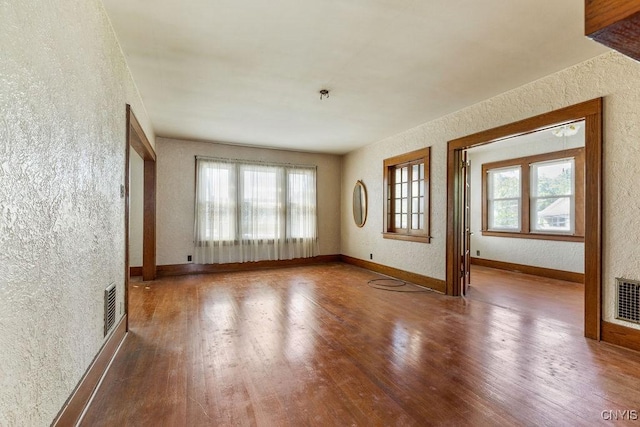 218-20 Avery Ave, Syracuse, NY 13204 - spare room featuring a textured wall, wood finished floors, and fire sprinkler in ceiling