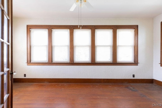 218-20 Avery Ave, Syracuse, NY 13204 - empty room with plenty of natural light, wood finished floors, and ceiling fan