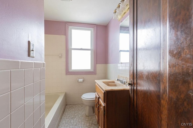 218-20 Avery Ave, Syracuse, NY 13204 - bathroom with tile walls, vanity, and wainscoting
