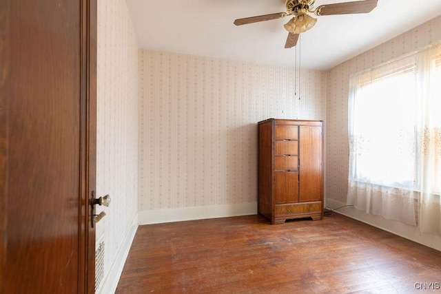 218-20 Avery Ave, Syracuse, NY 13204 - unfurnished room featuring wood finished floors, a ceiling fan, and wallpapered walls