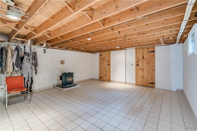 8782 Buck Point Rd, Watson, NY 13367 - below grade area with a wood stove