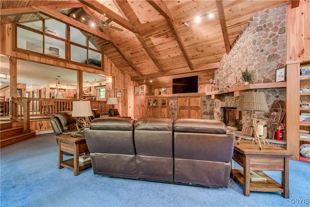 8782 Buck Point Rd, Watson, NY 13367 - living area with a wood ceiling with exposed beams, high vaulted ceiling, carpet floors, a stone fireplace, and stairway
