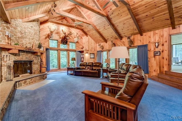 8782 Buck Point Rd, Watson, NY 13367 - living room with wood ceiling, carpet floors, wooden walls, a stone fireplace, and a ceiling fan