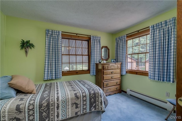 8782 Buck Point Rd, Watson, NY 13367 - bedroom featuring baseboard heating, a textured ceiling, and carpet floors