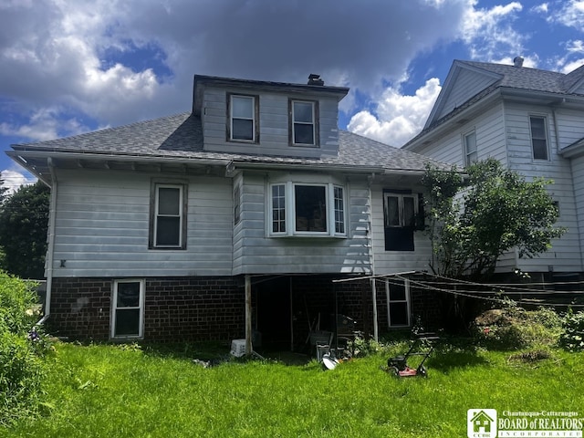 157 W Main St, Allegany, NY 14706 - rear view of house featuring a lawn, roof with shingles, and a chimney