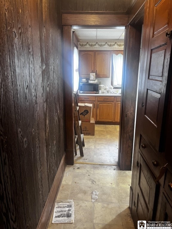 157 W Main St, Allegany, NY 14706 - hall featuring light flooring and wooden walls