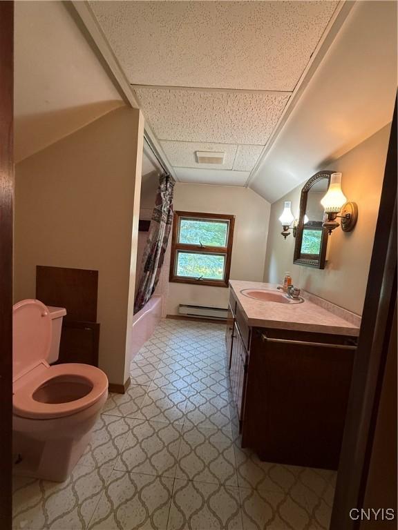 5877 State Route 233, Westmoreland, NY 13440 - full bath with baseboard heating, vanity, shower / tub combo, tile patterned floors, and lofted ceiling