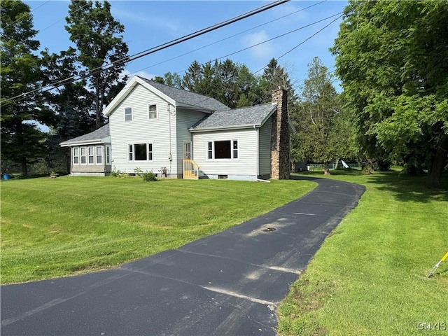 5877 State Route 233, Westmoreland, NY 13440 - traditional-style home with a chimney, a front yard, and a shingled roof