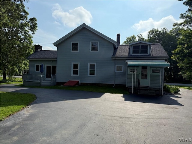 5877 State Route 233, Westmoreland, NY 13440 - view of front of house with a chimney, entry steps, a shingled roof, a wooden deck, and asphalt driveway