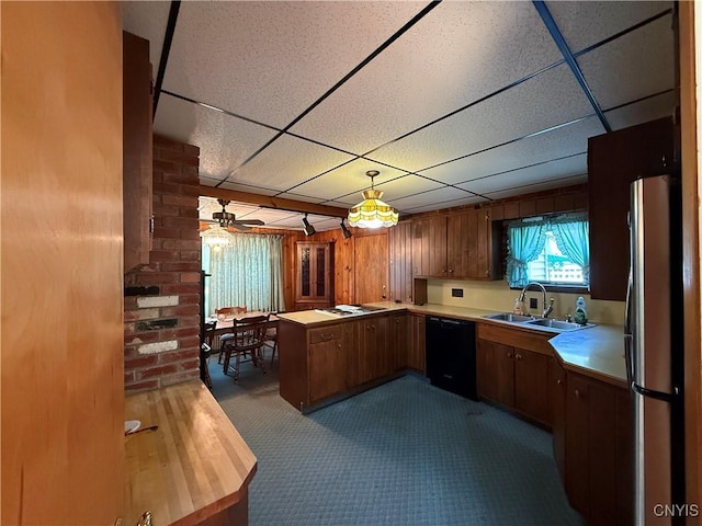 5877 State Route 233, Westmoreland, NY 13440 - kitchen featuring black dishwasher, freestanding refrigerator, a paneled ceiling, light countertops, and a peninsula