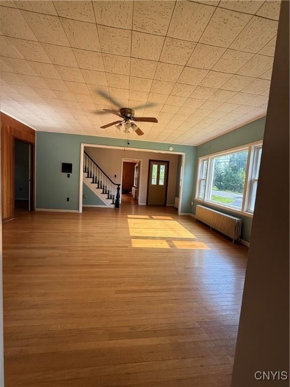 5877 State Route 233, Westmoreland, NY 13440 - entryway featuring radiator, stairs, a ceiling fan, and wood finished floors