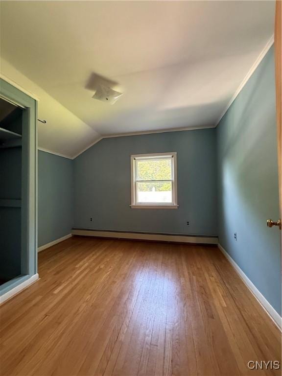 5877 State Route 233, Westmoreland, NY 13440 - additional living space featuring wood-type flooring, a baseboard radiator, and lofted ceiling