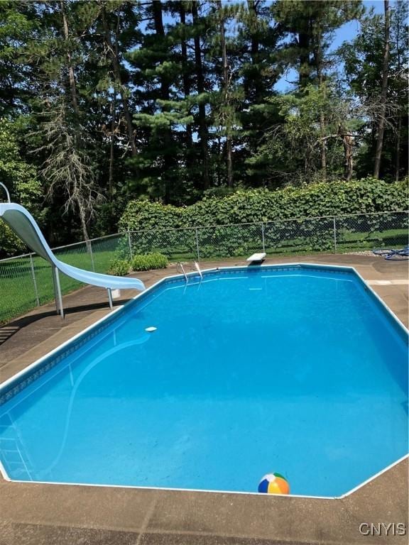 5877 State Route 233, Westmoreland, NY 13440 - view of pool featuring a water slide, a diving board, and a fenced backyard