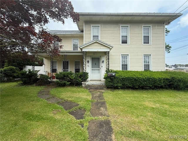 75 Main St, North Dansville, NY 14437 - view of front facade featuring a front yard