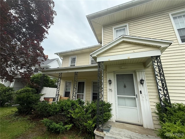 75 Main St, North Dansville, NY 14437 - entrance to property with a porch