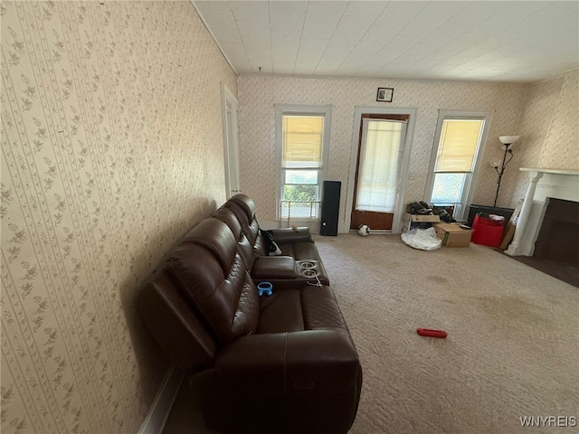75 Main St, North Dansville, NY 14437 - carpeted living room with wallpapered walls and a fireplace with flush hearth
