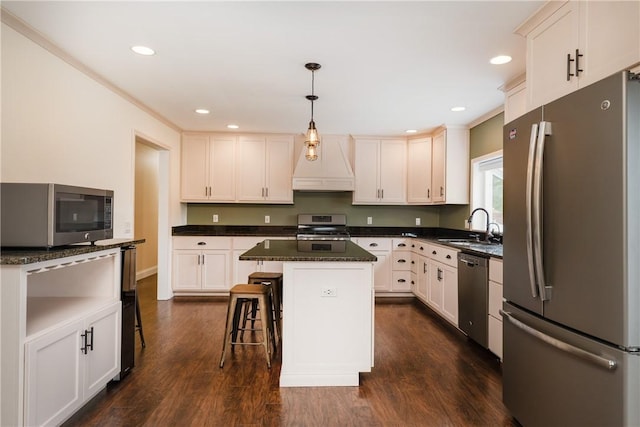 1192 Clendenning Rd, Lindley, NY 14870 - kitchen featuring appliances with stainless steel finishes, custom exhaust hood, dark wood-style flooring, a center island, and decorative light fixtures