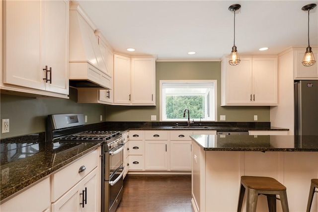 1192 Clendenning Rd, Lindley, NY 14870 - kitchen with double oven range, premium range hood, pendant lighting, dark stone counters, and recessed lighting