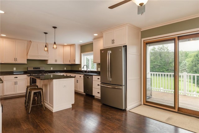 1192 Clendenning Rd, Lindley, NY 14870 - kitchen with appliances with stainless steel finishes, custom exhaust hood, recessed lighting, dark countertops, and dark wood-style flooring