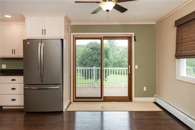 1192 Clendenning Rd, Lindley, NY 14870 - kitchen featuring freestanding refrigerator, a baseboard heating unit, white cabinetry, ceiling fan, and crown molding