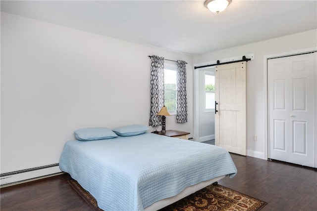 1192 Clendenning Rd, Lindley, NY 14870 - bedroom featuring baseboard heating, a barn door, and wood finished floors