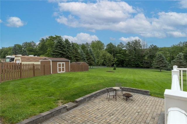 1192 Clendenning Rd, Lindley, NY 14870 - fenced backyard featuring a storage unit, a patio area, and a fire pit
