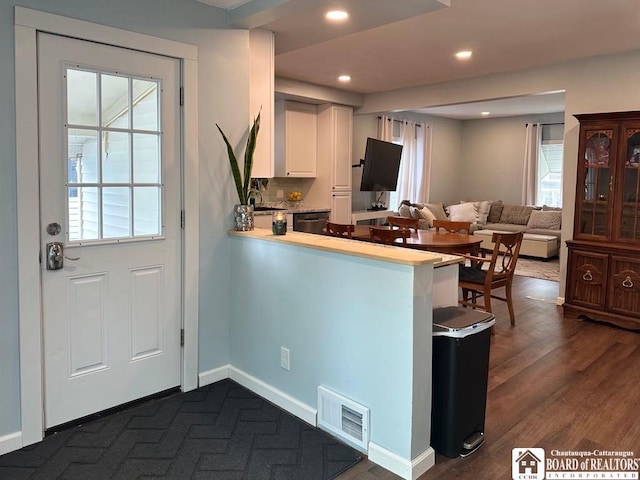 12 Juliet St, Jamestown, NY 14701 - kitchen with light countertops, black dishwasher, a peninsula, white cabinets, and recessed lighting