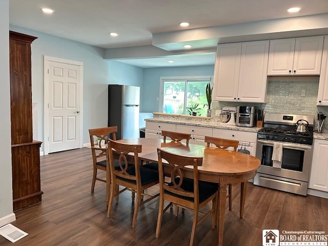 12 Juliet St, Jamestown, NY 14701 - kitchen with gas stove, freestanding refrigerator, backsplash, dark wood-style floors, and recessed lighting