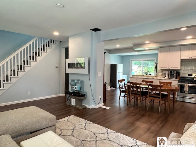12 Juliet St, Jamestown, NY 14701 - living area with stairs, dark wood finished floors, and recessed lighting