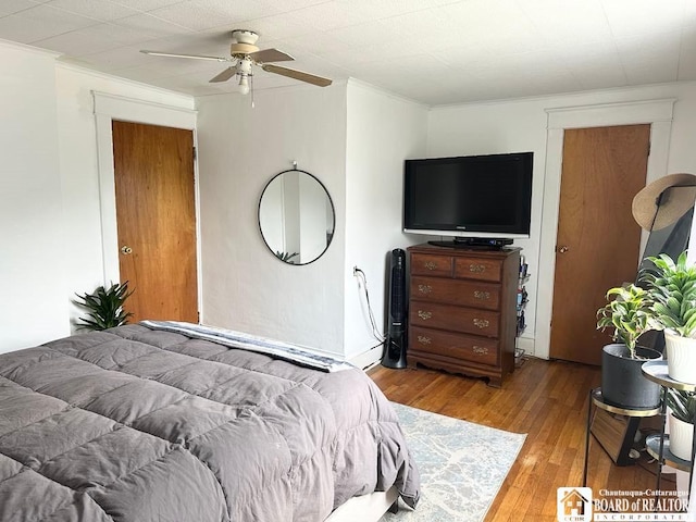 12 Juliet St, Jamestown, NY 14701 - bedroom with wood-type flooring, crown molding, and a ceiling fan