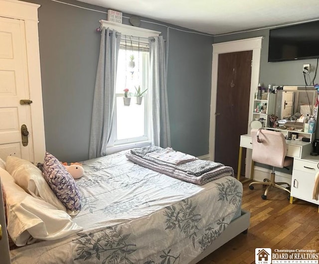 12 Juliet St, Jamestown, NY 14701 - bedroom featuring dark wood-style flooring and an office area