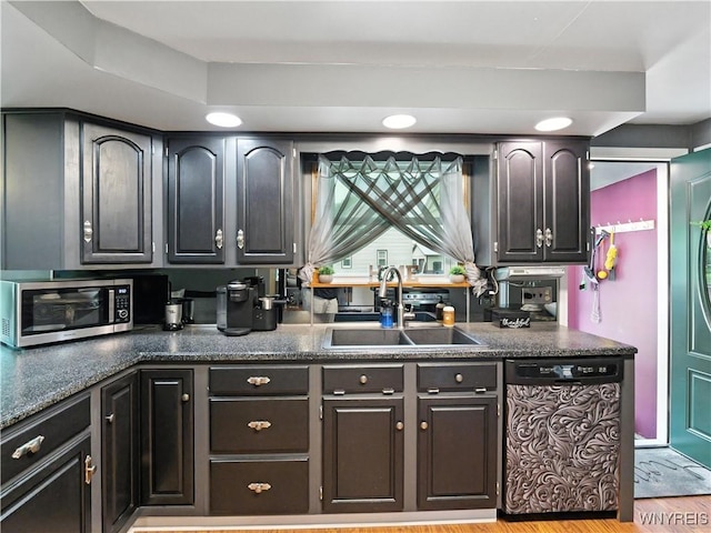 5137 William St, Lancaster, NY 14086 - kitchen with dishwasher, dark countertops, stainless steel microwave, and light wood-type flooring